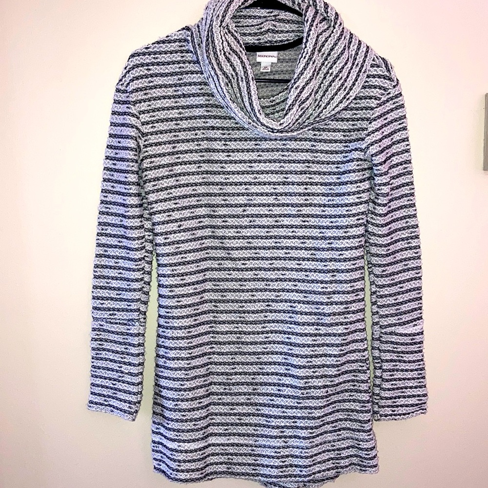 Woman’s long striped sweater